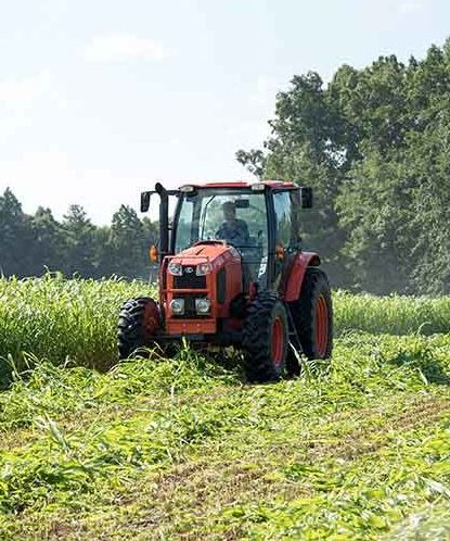 A farmer driving a tractor 